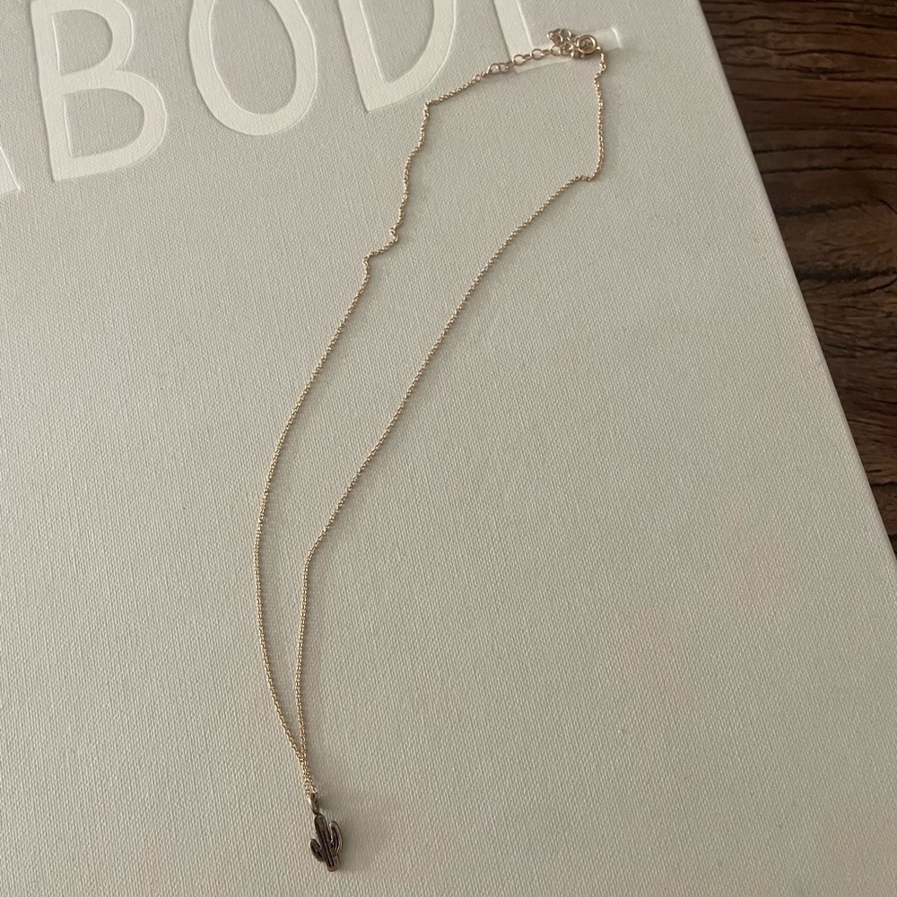 Small cactus necklace. Perfect size. gold. Can wear in water.